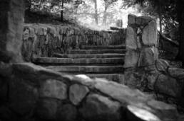 Black and white landscape photograph of steps and stonewall