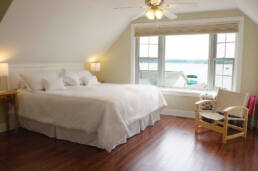 Real estate photography photo of bedroom overlooking lake